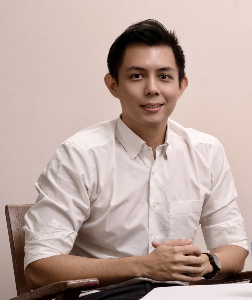 Dr. Ye Yint in a white shirt